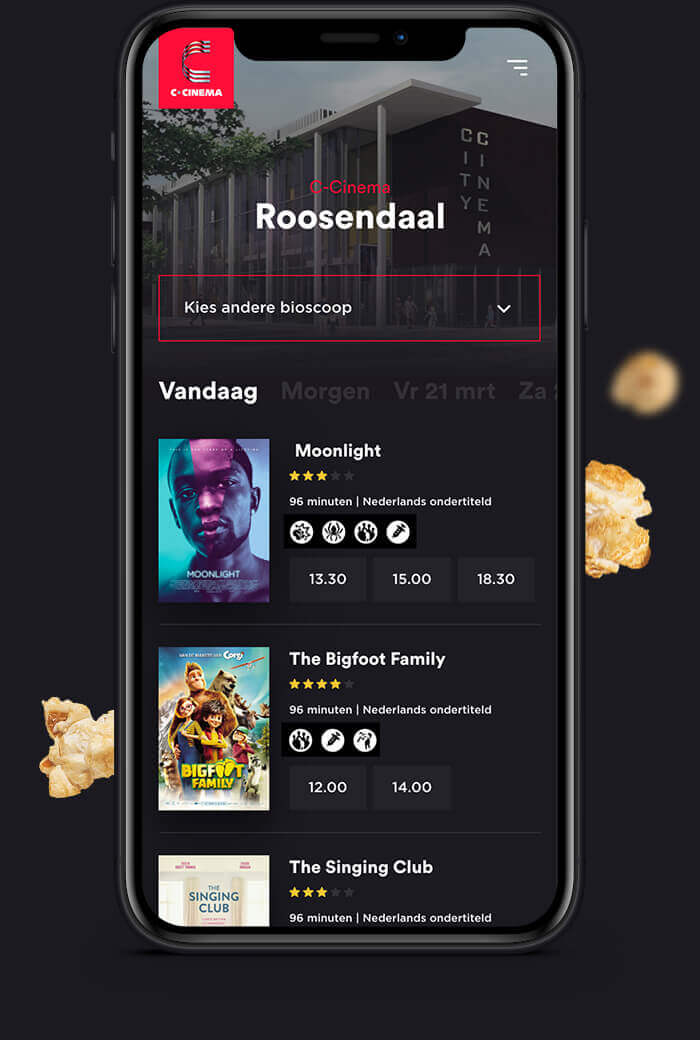 Telefoonscherm met film-app: filmkeuze, beoordelingen, aanvangstijden en popcorn bij de hand.