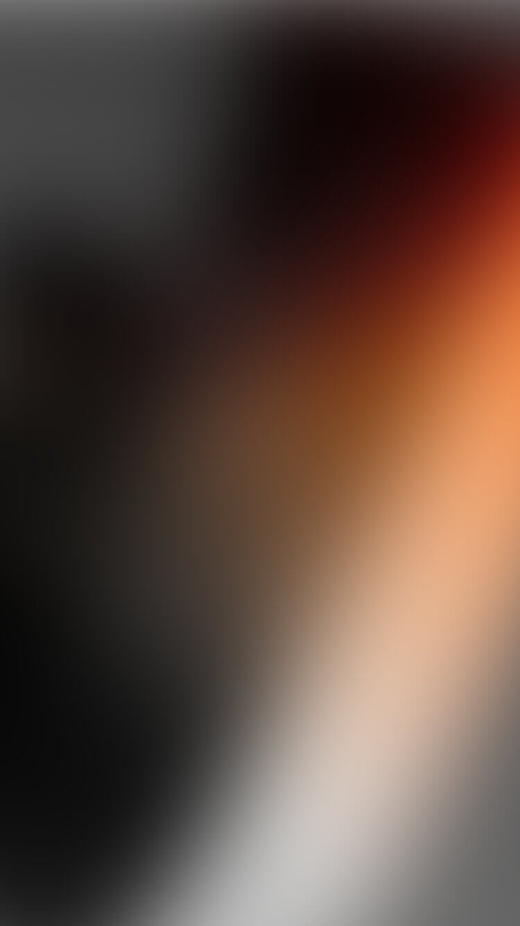 Vage overgang van donker naar lichtoranje met zachte, ongedefinieerde vormen.