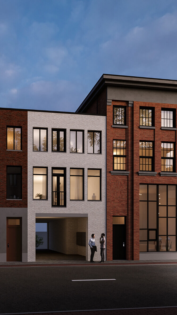 Twee mensen praten bij zonsondergang buiten moderne bakstenen gebouwen.