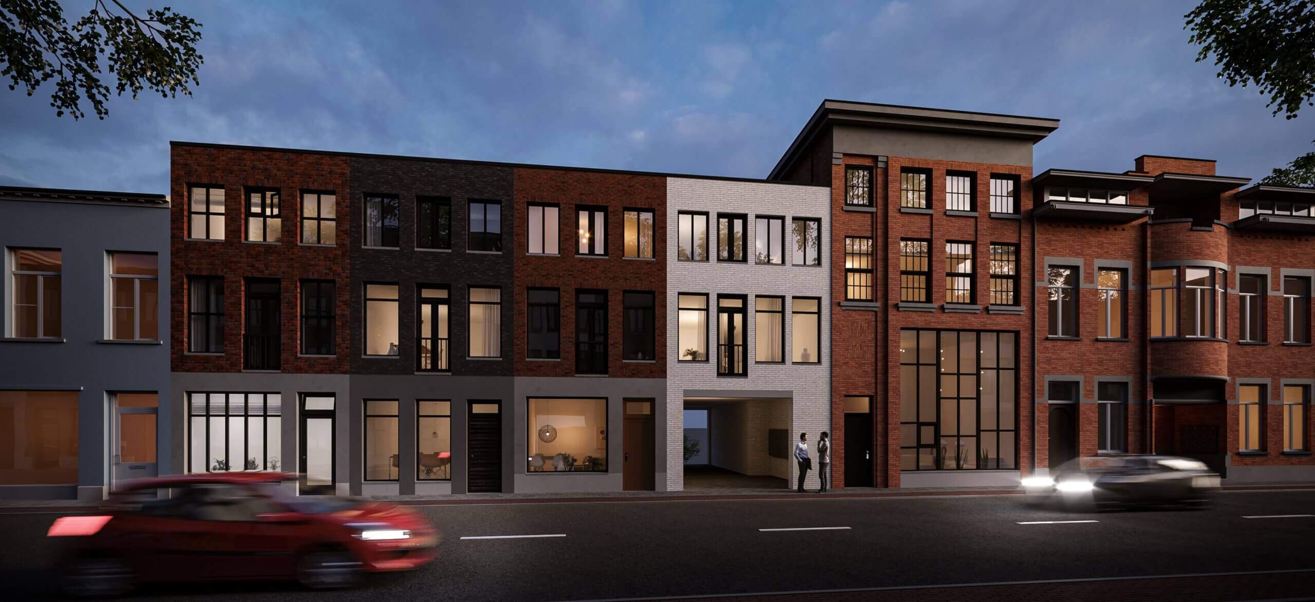 Bakstenen huizen in de schemering, met passerende auto's ervoor.